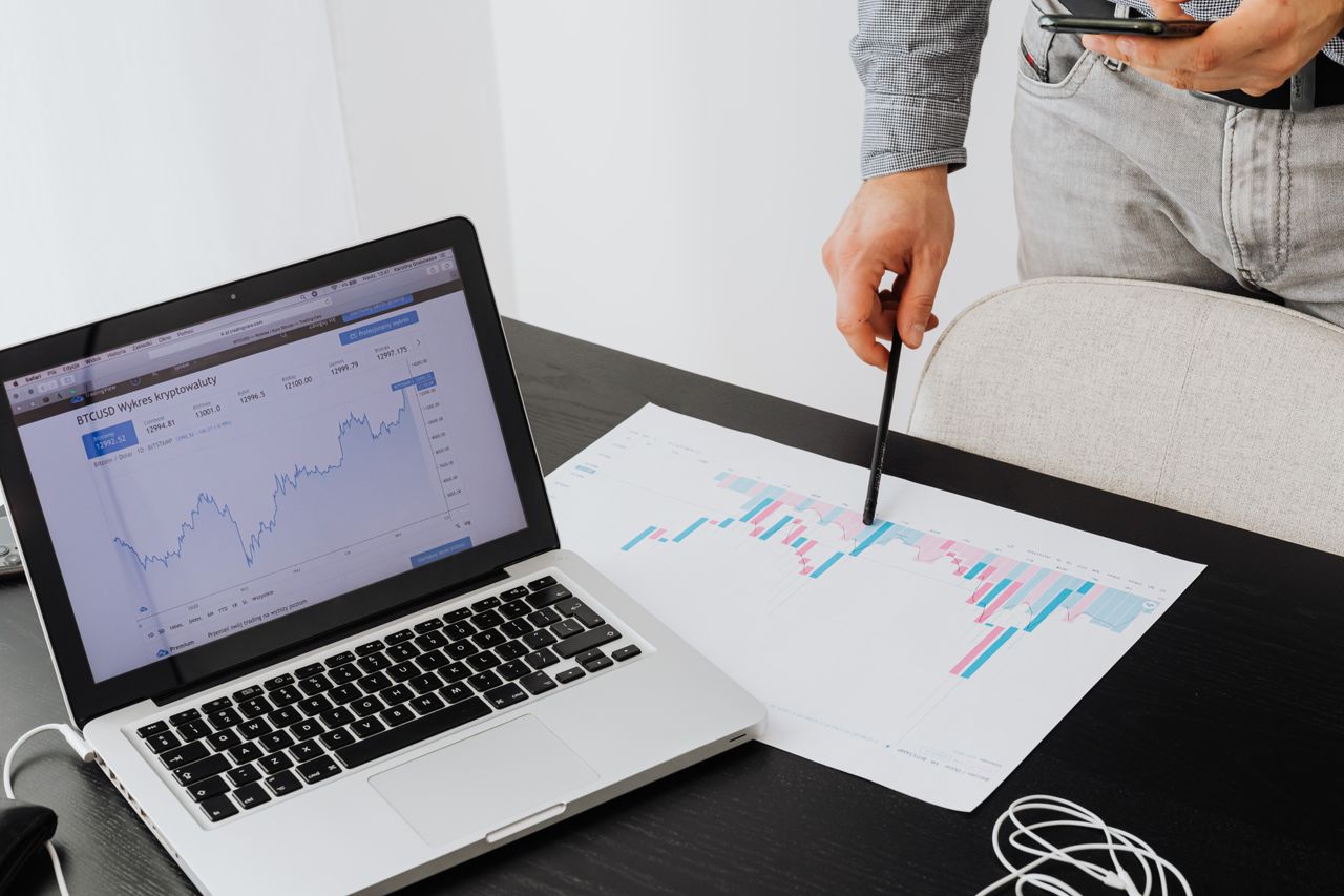 cta-bg Person analyzing cryptocurrency data using a laptop, highlighting financial insights.